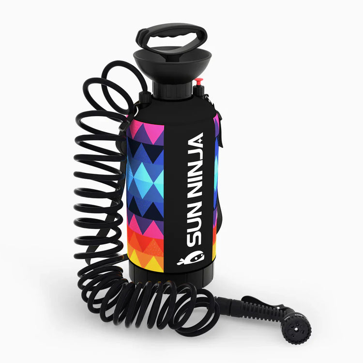 Sunscreen spray bottle with colorful design and coiled nozzle on a white background