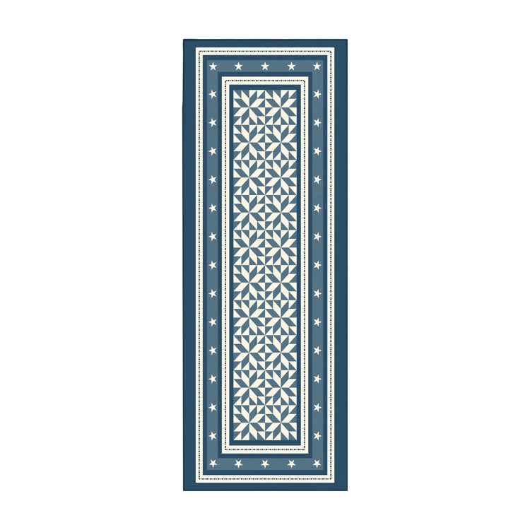 Rectangular blue and white patterned rug on a white background