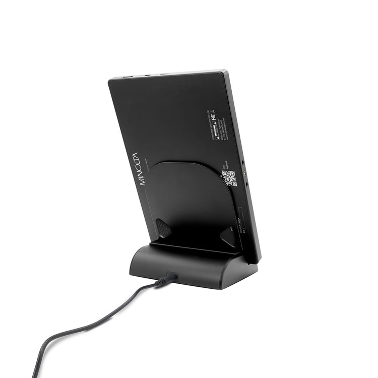 Black smartphone stand with cable on a white background