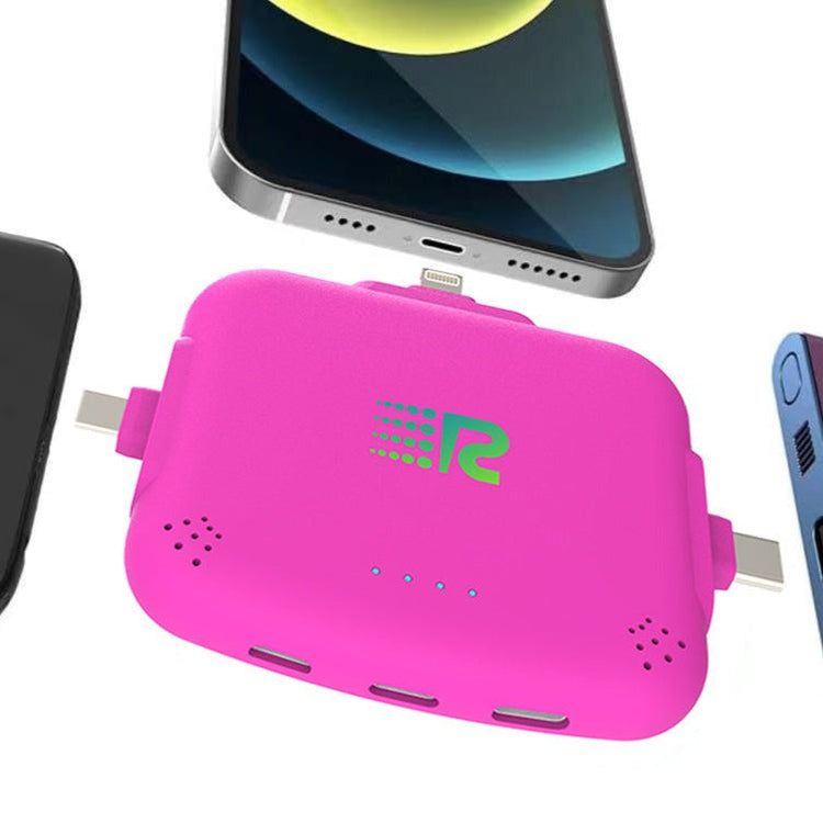 Pink portable charger with multiple ports and a smartphone above it on a white background