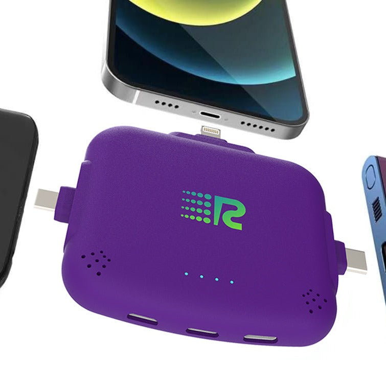 Purple multi-device charging hub with a smartphone and tablet in the background