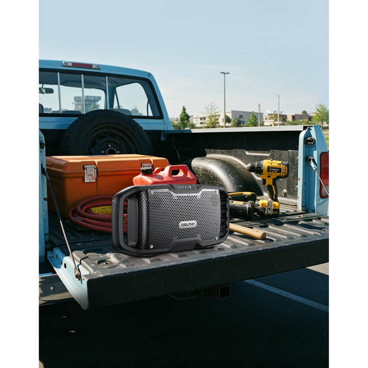 Toolbox and equipment on a truck bed with a clear sky background