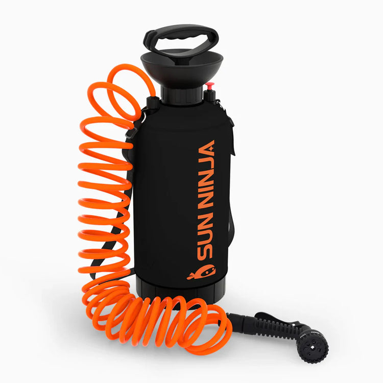 Black and orange Sun Ninja sprayer with coiled hose on a white background