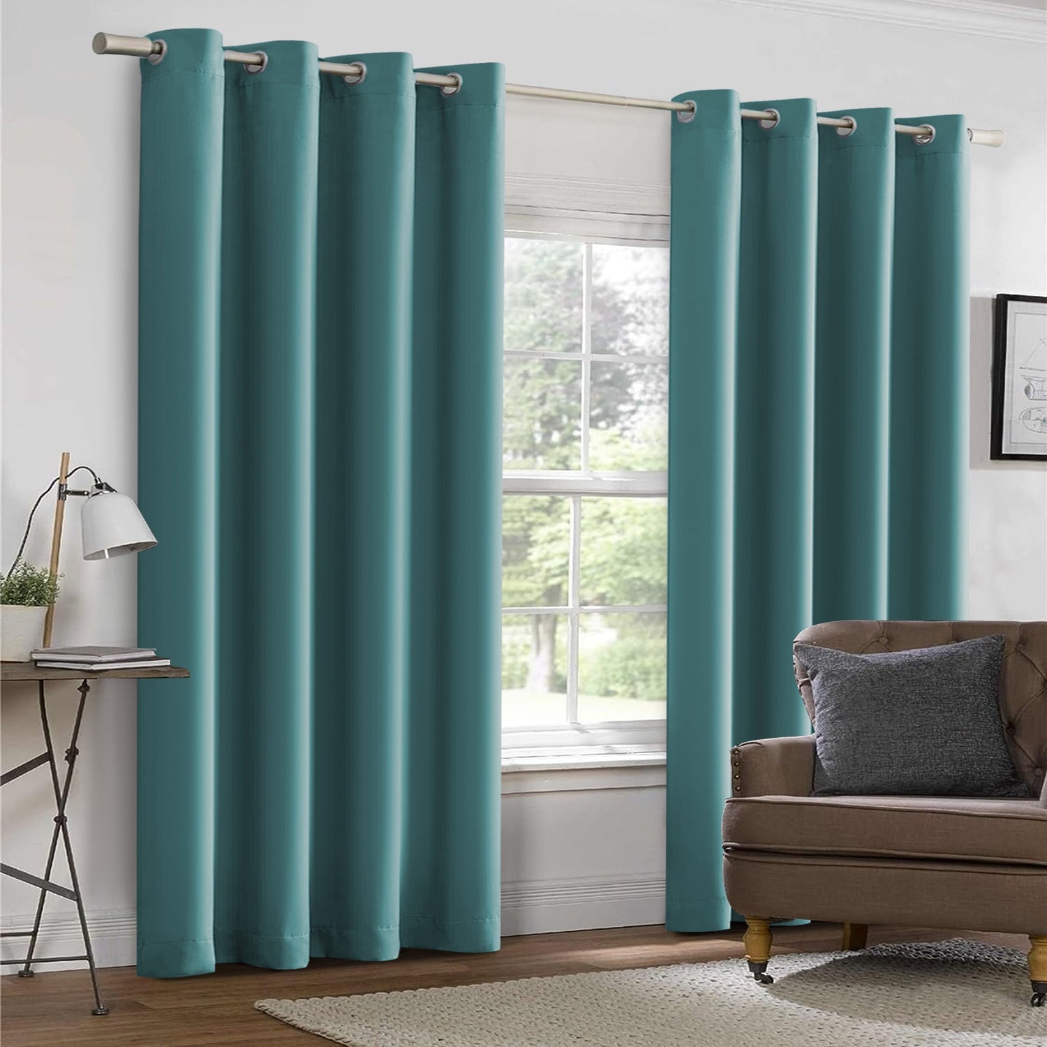 Teal curtains in a room with a couch and window