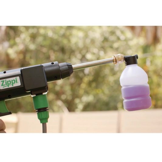 A Zippi Hydro Cleaner Deluxe with a black color scheme, including a gun handle, hose, nozzles, a carrying case, and other accessories.