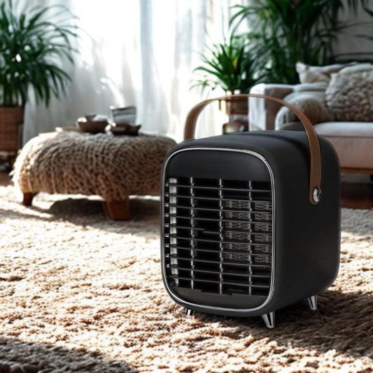Small black heater on a beige surface with a warm glow