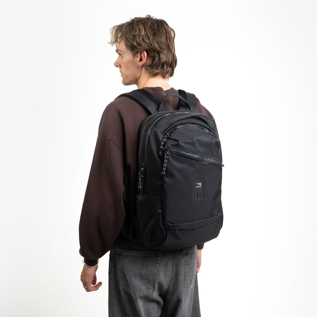 Boy using the Lander commuter hero backpack