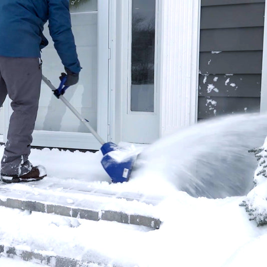 Blue snow shovel with attachments on a white background