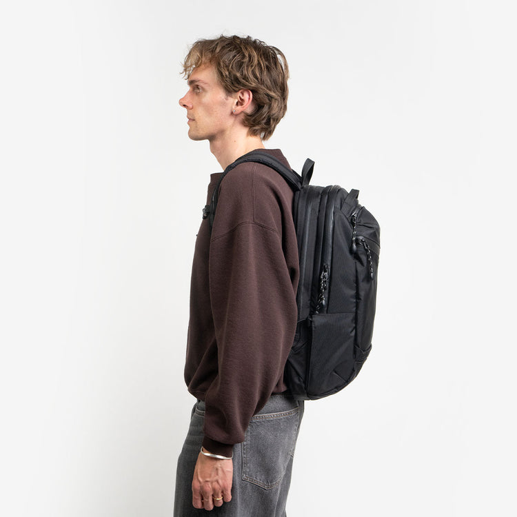 Boy using the Lander commuter hero backpack