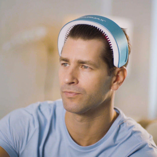 Hairmax device with blue and white design on a white background