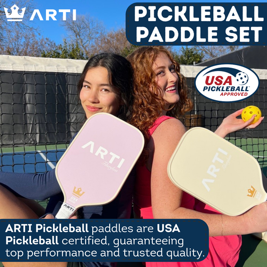 Pickleball paddles with colorful designs, a blue drawstring bag, and orange pickleballs on a white background.