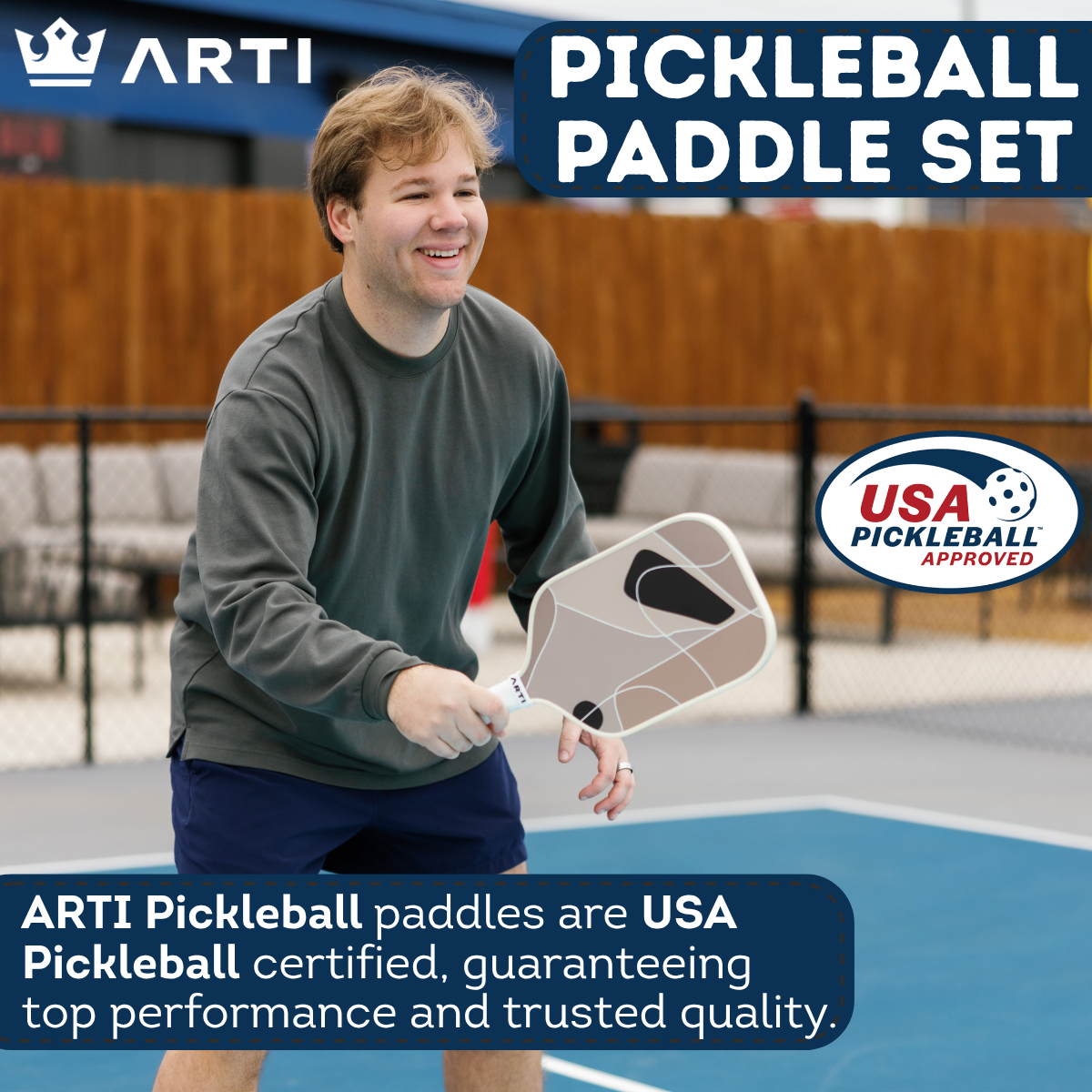 Person holding a pickleball paddle on a court with ARTI branding and USA Pickleball certification.