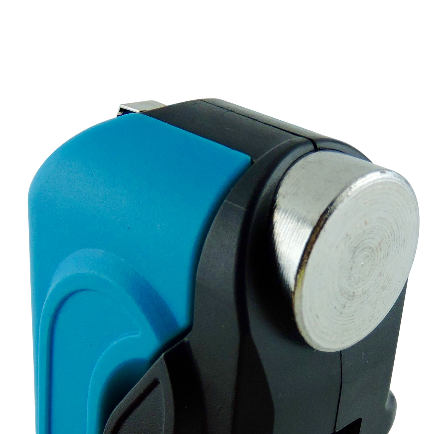 Close-up of a blue and black device with a metallic button on a white background