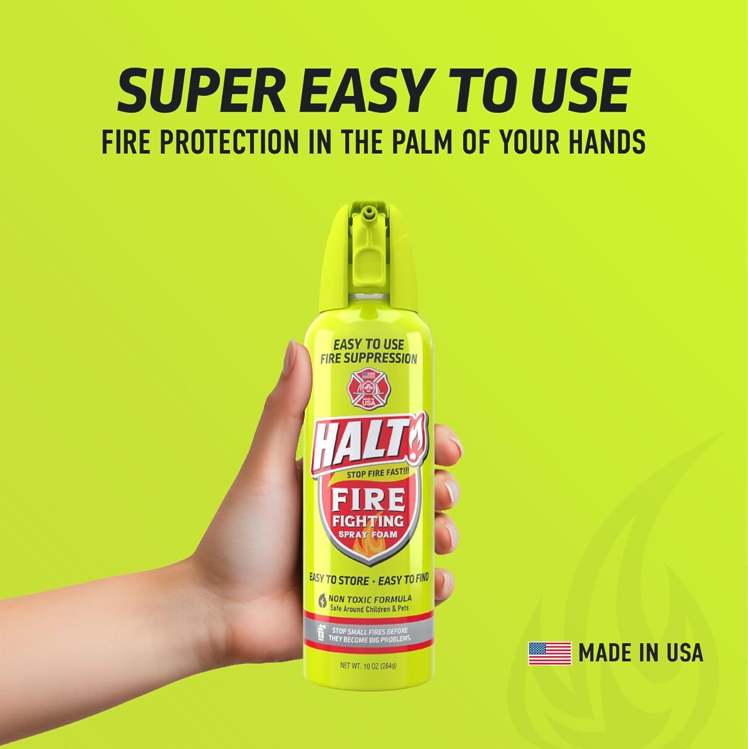 HALT fire fighting spray can held in a hand with green background