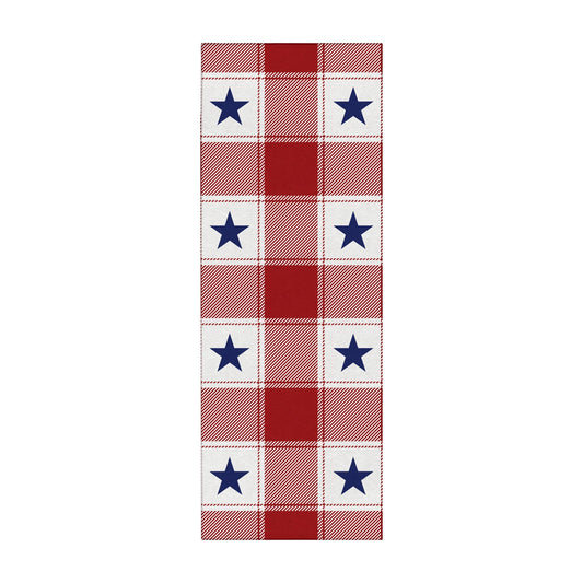 Wooden bench with American flag pillow and plaid rug on wooden floor