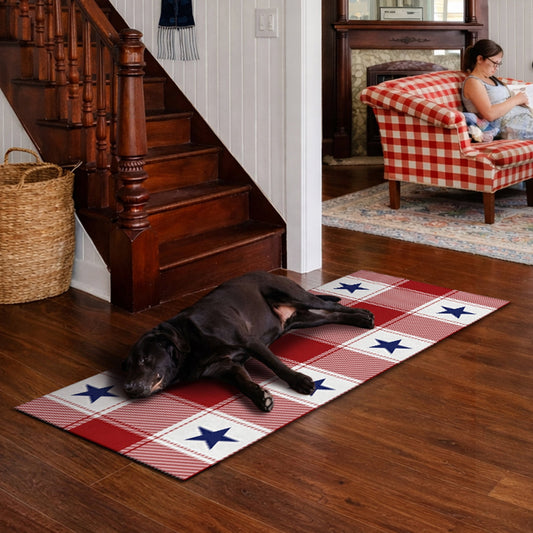 Wooden bench with American flag pillow and plaid rug on wooden floor