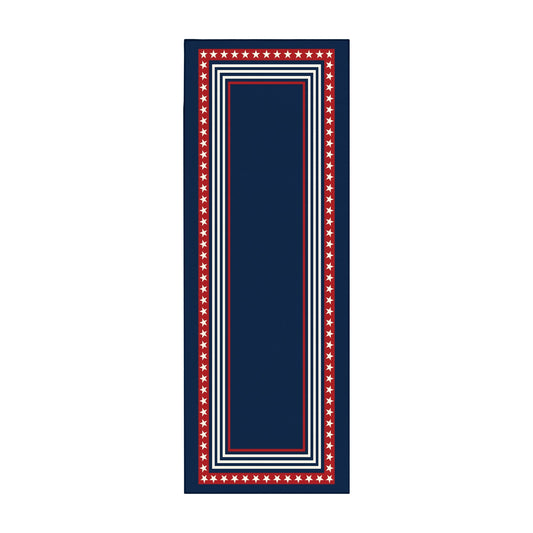 Navy blue rug with red and white border in front of a wooden bench and American flag.