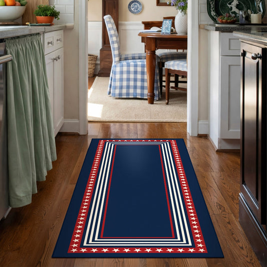 Navy blue rug with red and white border in front of a wooden bench and American flag.