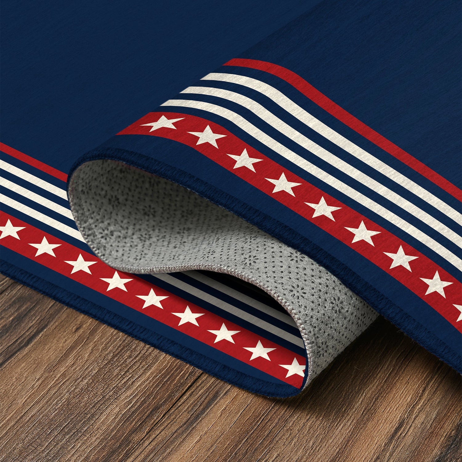 Freedom stars and stripes washable rug with navy center, red star border, and layered stripe frame designed for patriotic decor in living rooms, bedrooms, and hallways.