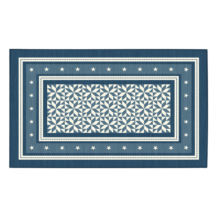 Rectangular blue rug with white geometric pattern and star border on a white background