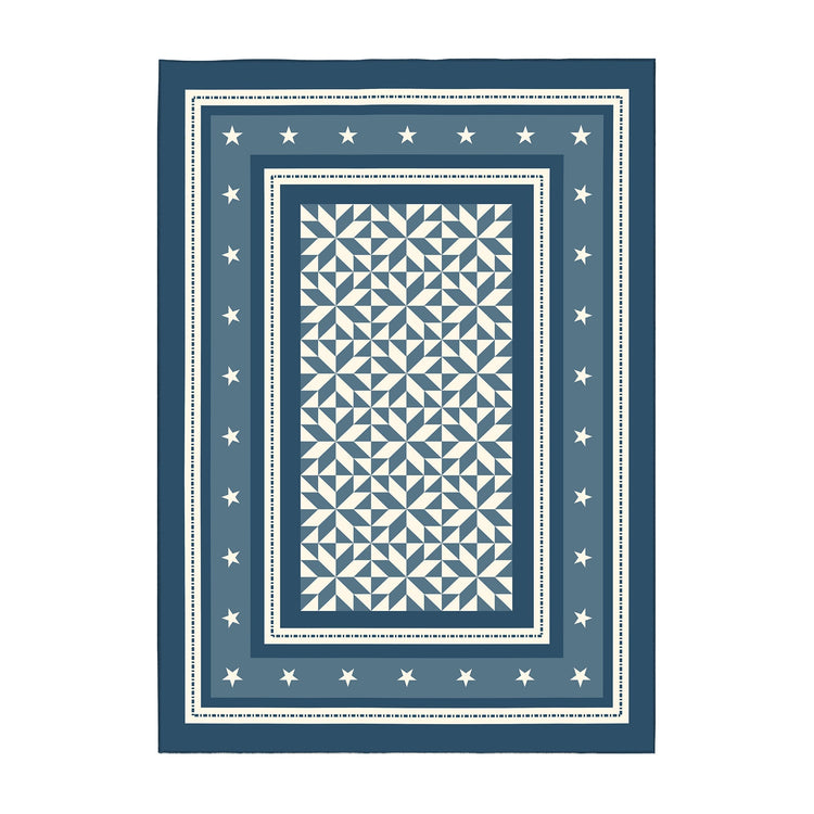 Blue and white patterned rug with star border on a white background