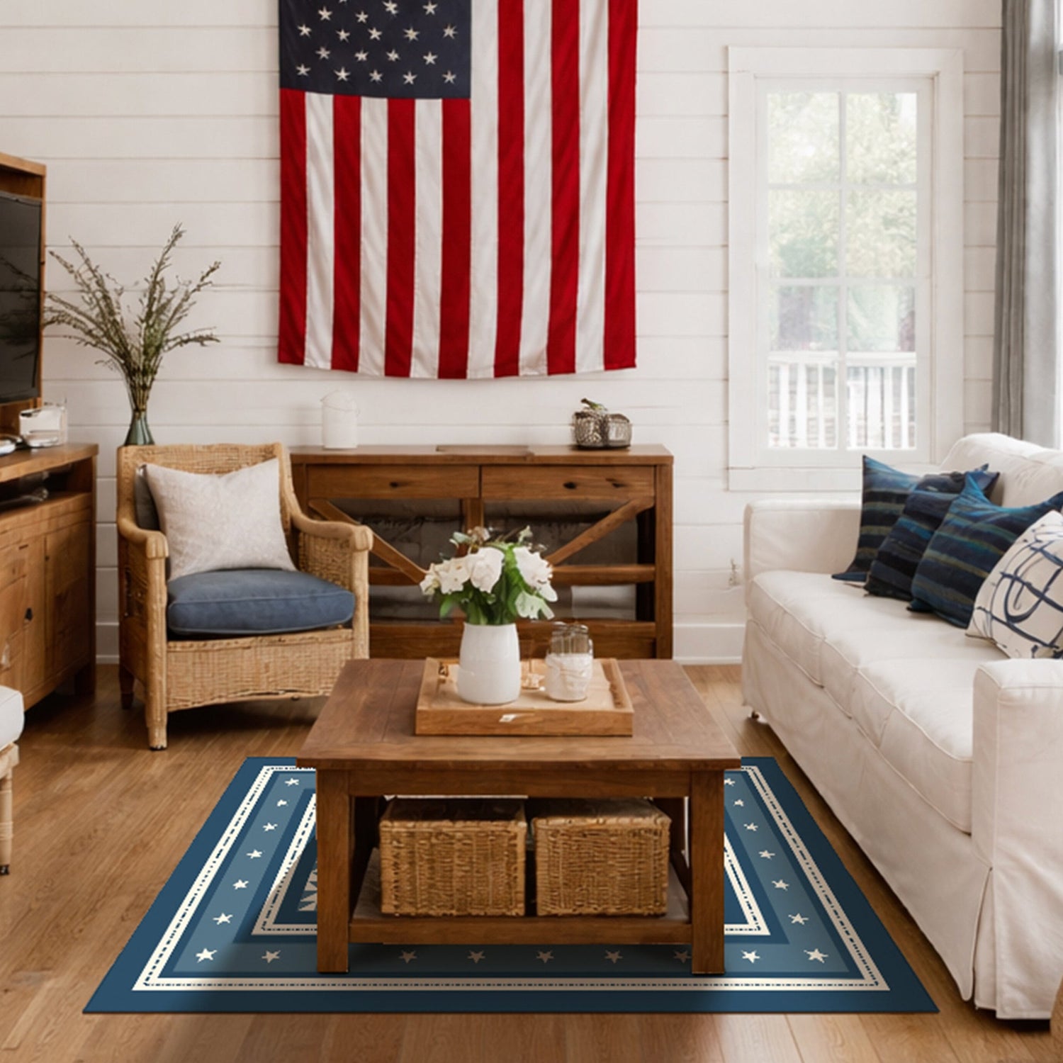 Living room with American flag, wooden furniture, and a blue rug with star patterns.