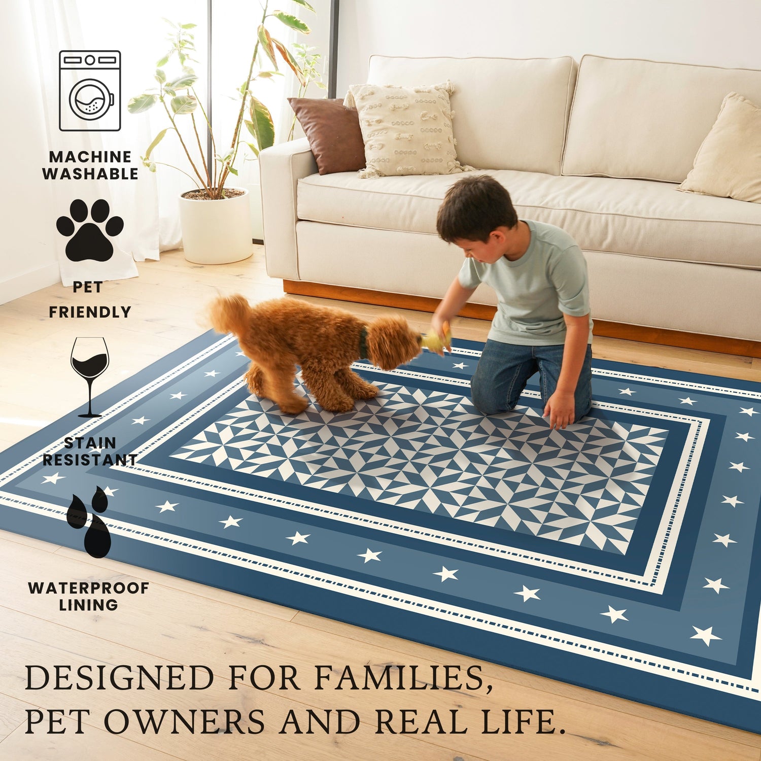 Child playing with a dog on a blue patterned rug in a living room.