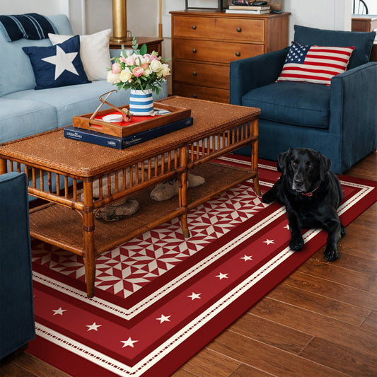 Decorative red and white patterned rug on a wooden floor in a kitchen.