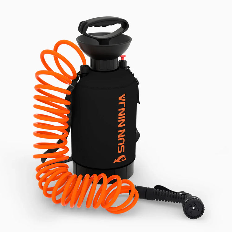 Black spray bottle with orange coiled hose on a white background