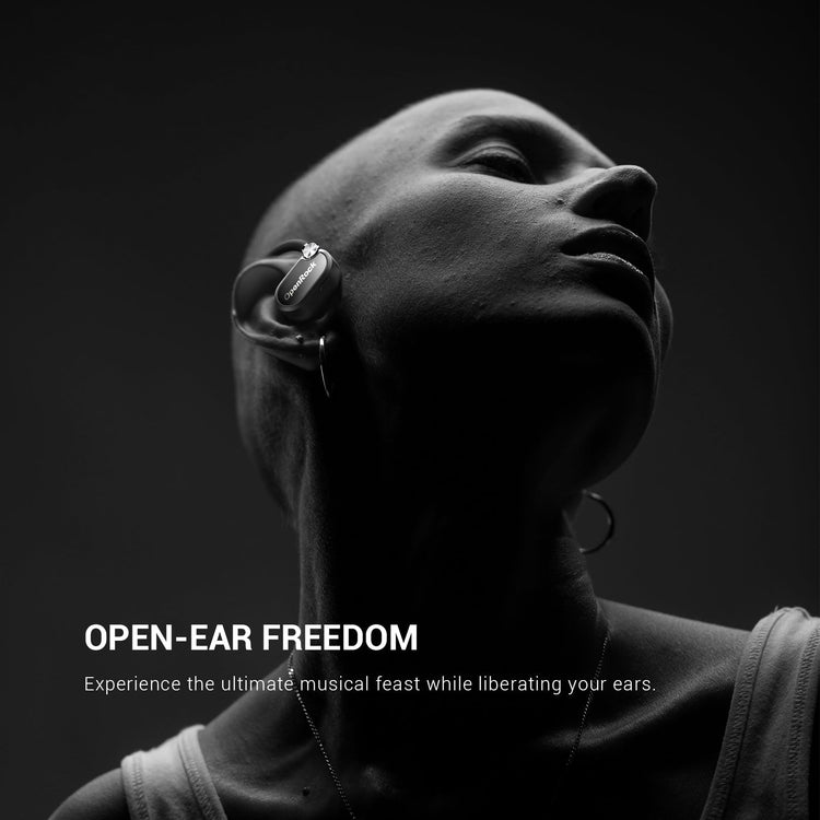 Person wearing wireless earbuds with 'Open-Ear Freedom' text on a dark background