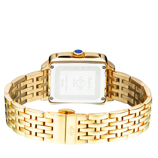 Gold wristwatch with a detailed face on a white background
