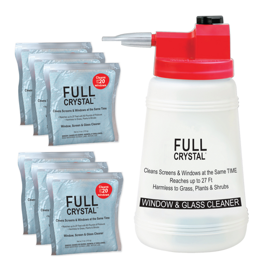 Person using a hose to clean the exterior of a house