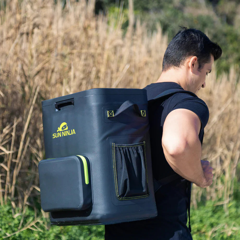 Person wearing a large blue backpack with 'SunNinja' branding in an outdoor setting.