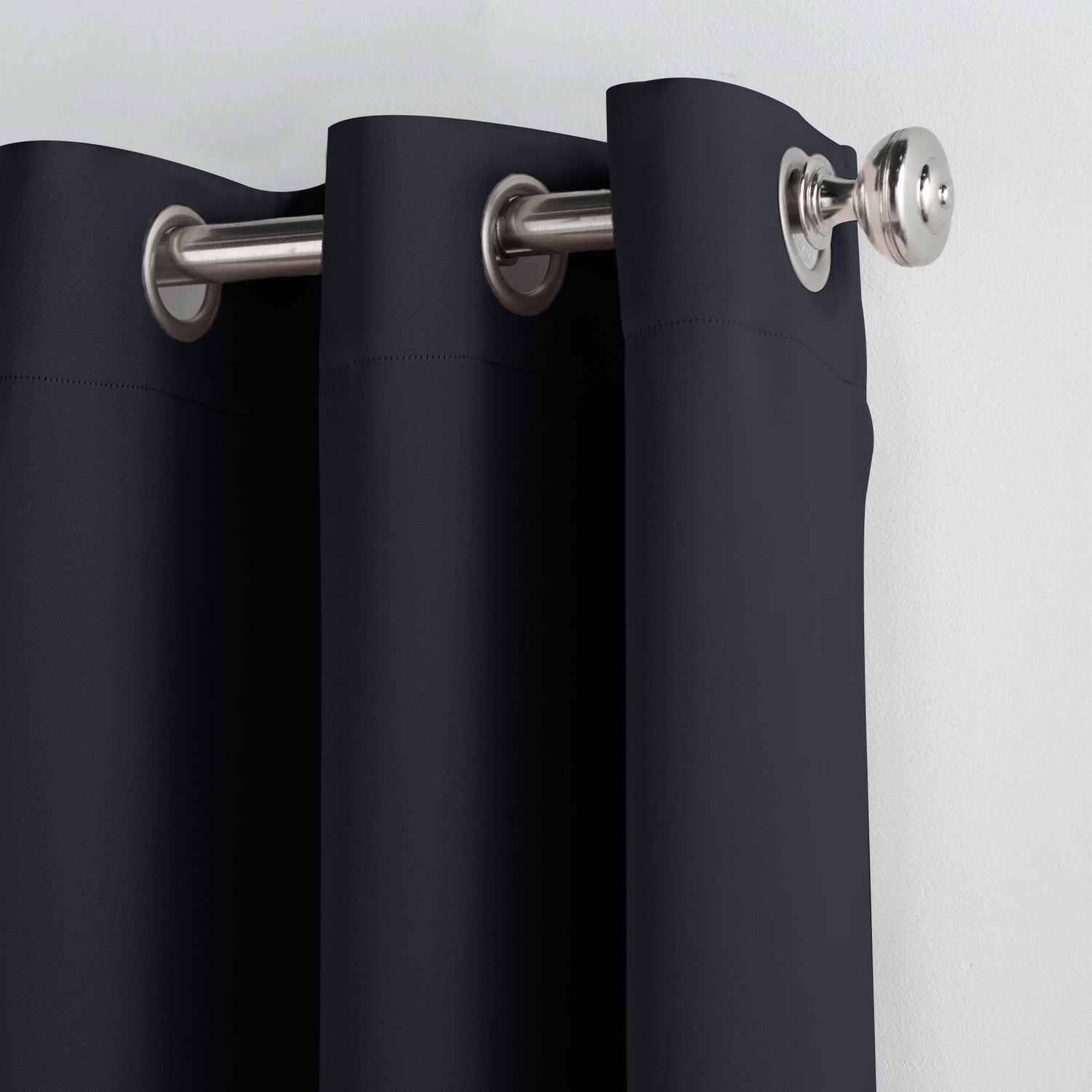 Black curtains with silver rings on a white background