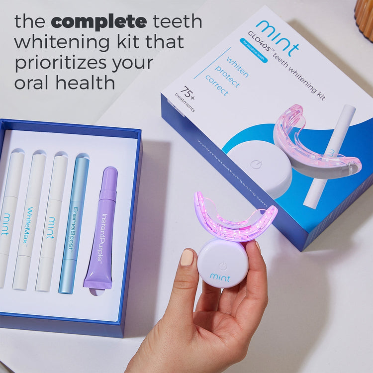 Mint teeth whitening kit with LED light and packaging on a white background