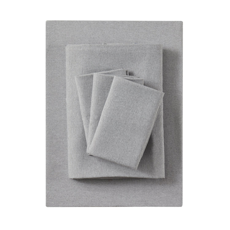 Gray textured fabric set including a sheet, pillowcase, and blanket on a white background