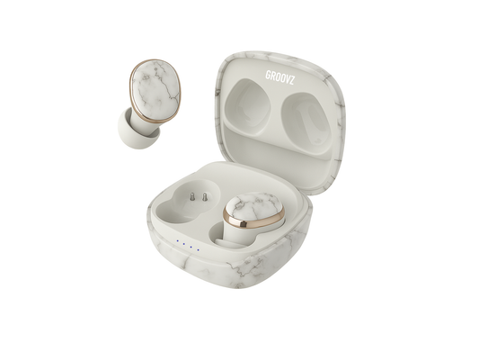 Marble-patterned wireless earbuds with charging case on a white background