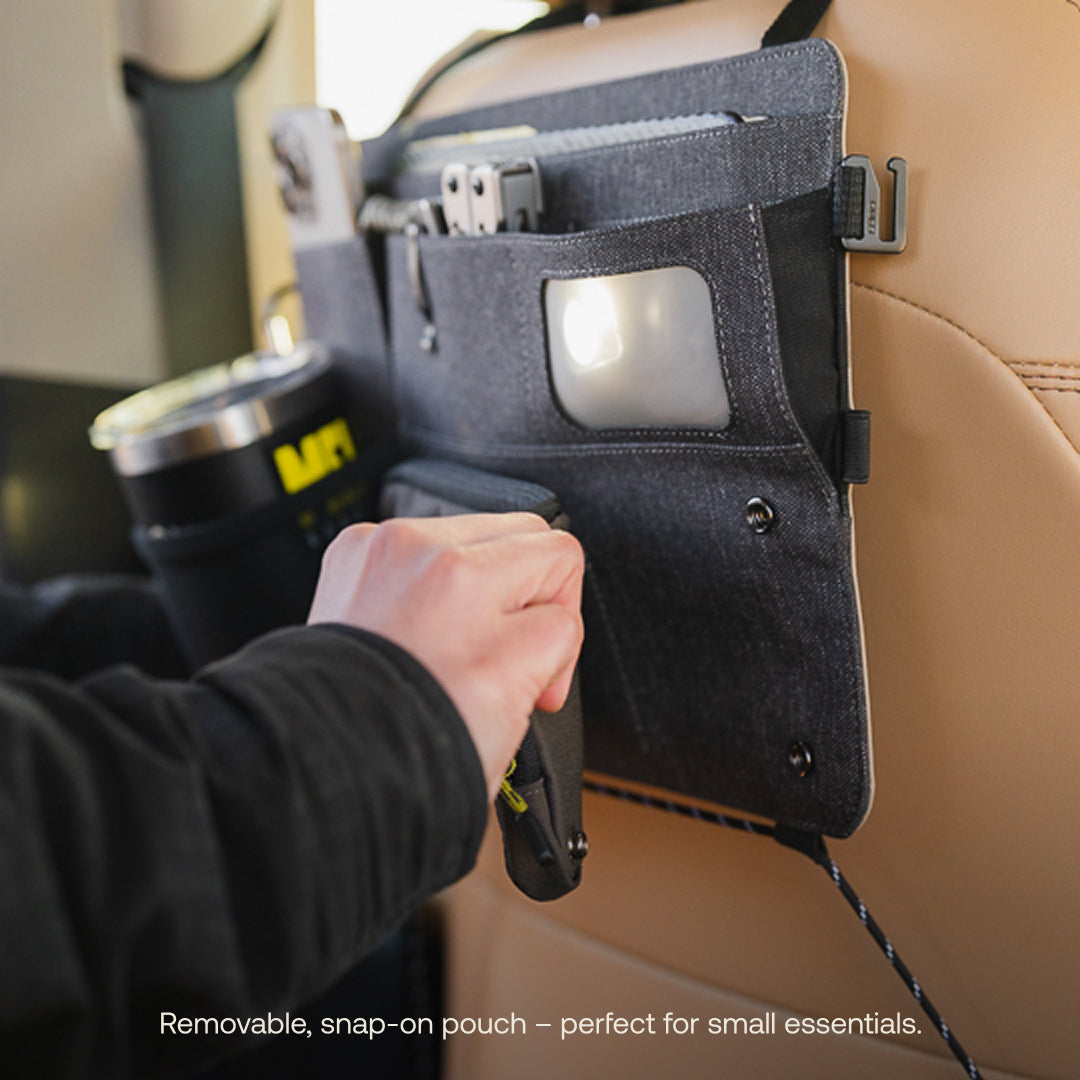 A tan Seatback Organizer by Luno® is attached to a car seat for convenience. It's perfect for vehicle organization, with a person placing a small bag into it. The text reads: "Removable, snap-on pouch – ideal for small essentials.
