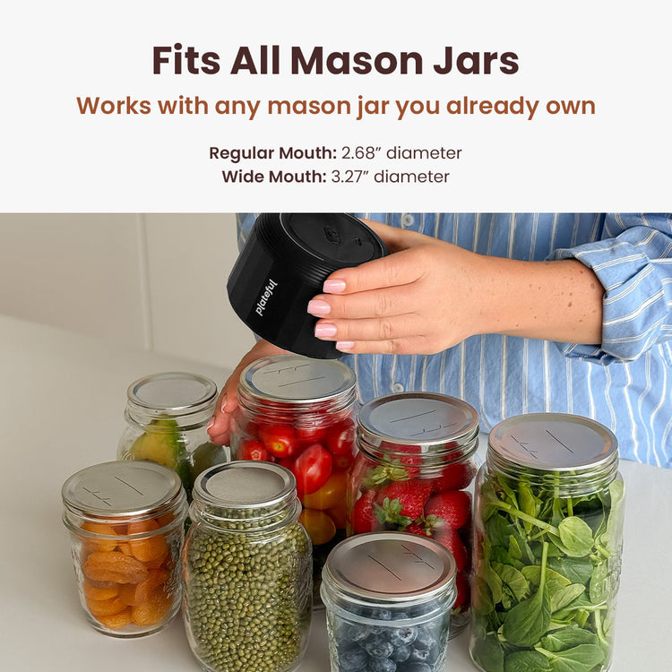 Person using a black lid on mason jars filled with food