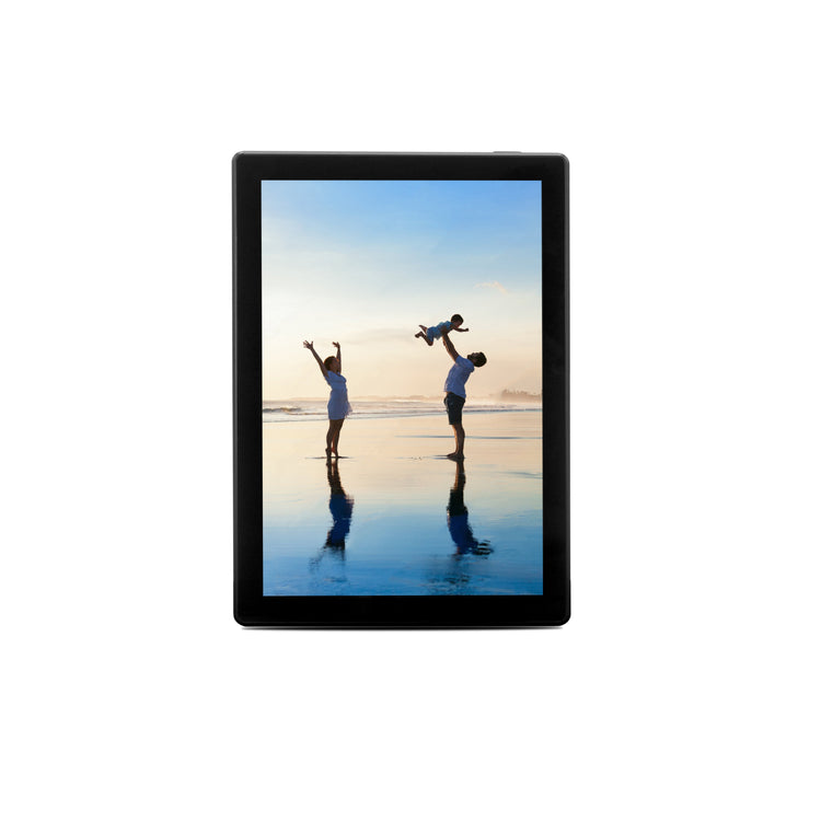 Digital photo frame displaying a couple on a beach with a child.