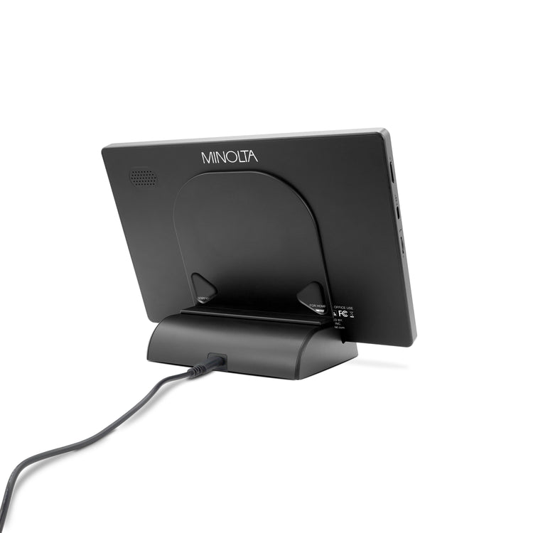 Black electronic device with 'Minolta' branding on a white background