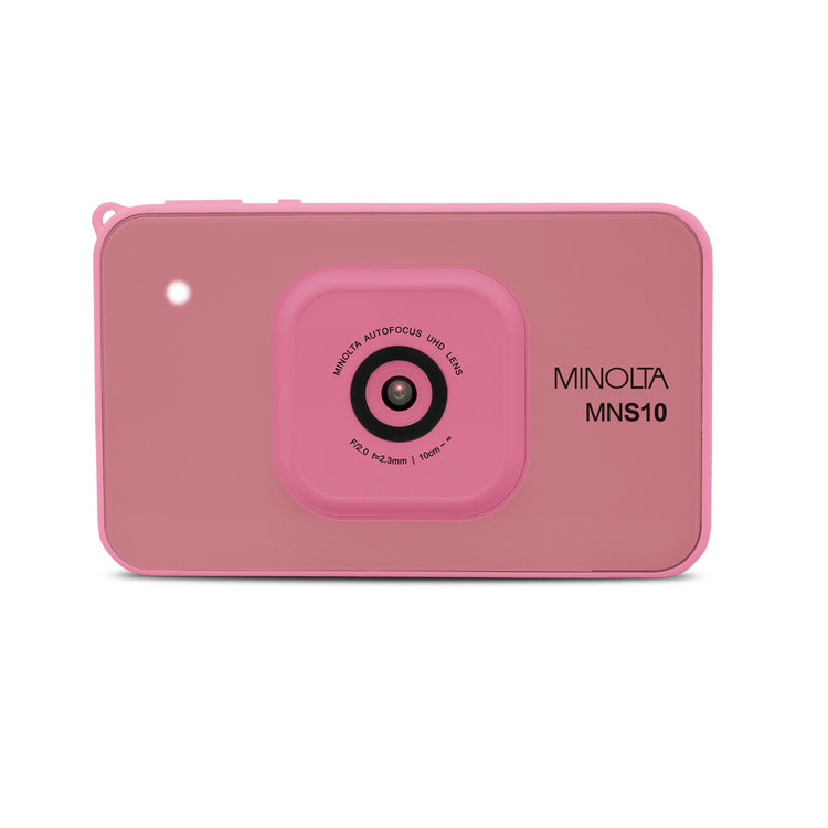 Pink camera-shaped device with 'Minolta' branding on a white background