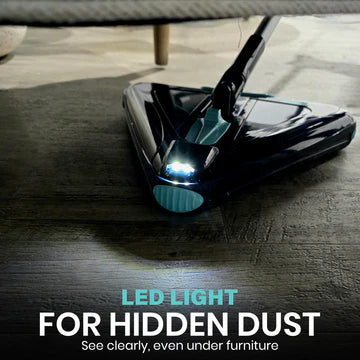 Vacuum cleaner with LED light on a wooden floor, highlighting its feature for cleaning hidden dust.