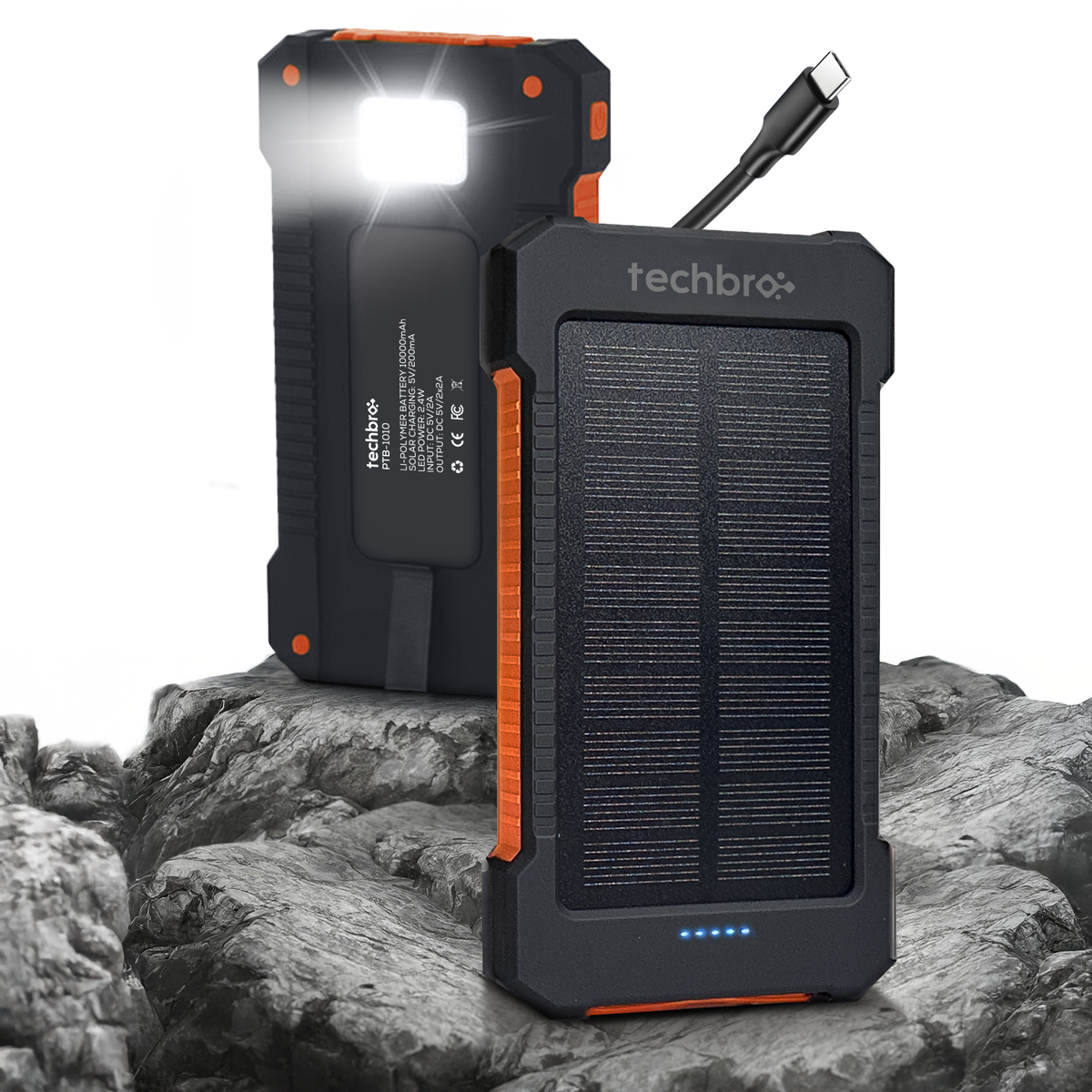 Techbro solar power bank with flashlight on a rocky surface