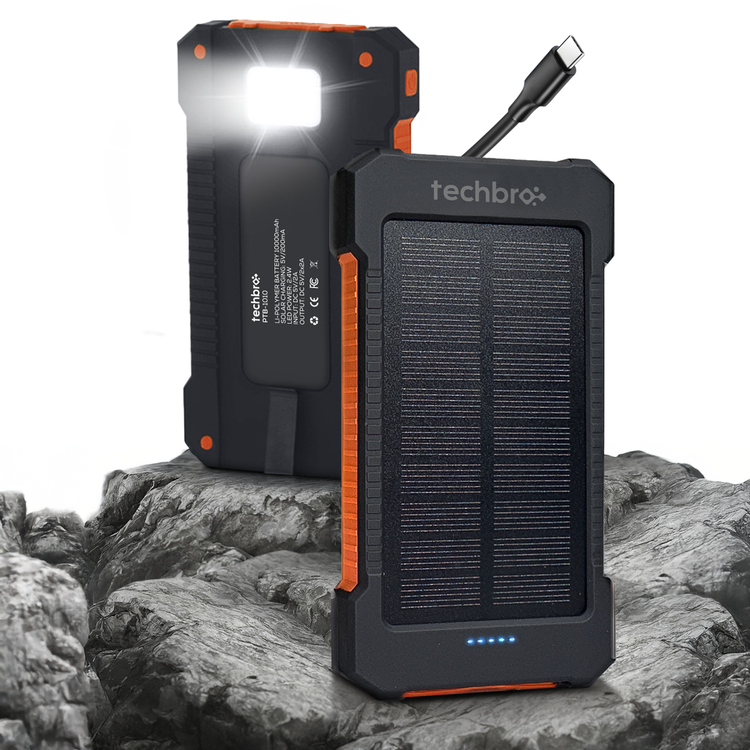 Techbro solar power bank with flashlight on a rocky surface