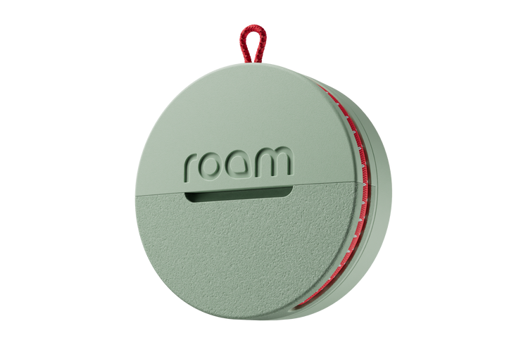 Round green device with 'roam' branding on a white background