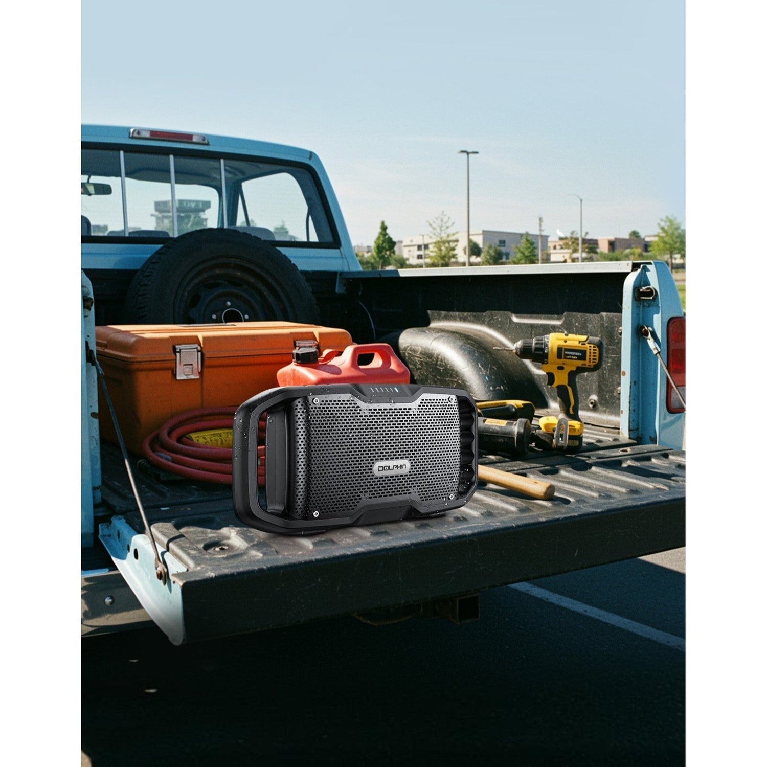Toolbox and equipment on a truck bed with a clear sky background