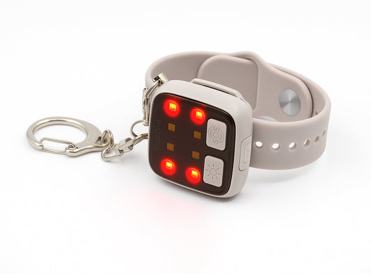 Small electronic device with a keychain attached on a white background