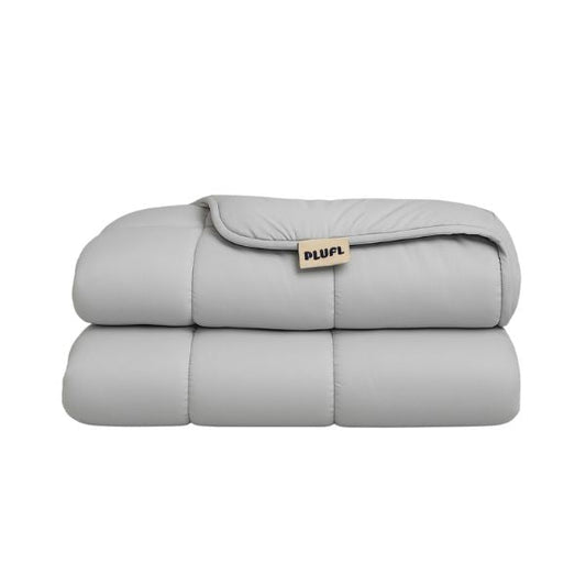 Folded gray weighted blanket with 'PLUFL' label on a white background