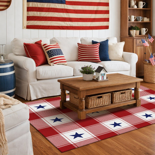 Wooden bench with decorative pillows on a porch featuring a red, white, and blue striped rug.
